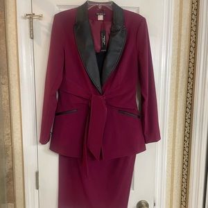 Never worn red dress suit with black leather look trim. Great for an interview.